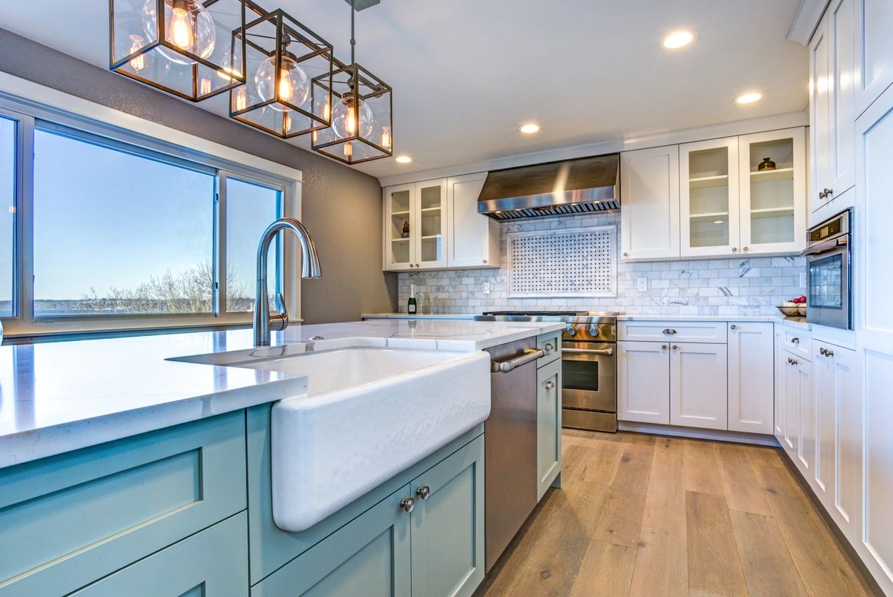 Image of a kitchen refaced with shaker style cabinets and quartz countertop